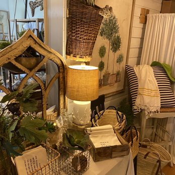 Saltwater Cottage - a table with baskets and a lamp - Specialty Food Near Me - Navarre, Florida Saltwater Cottage - a table with baskets and a lamp - Specialty Food Near Me - Navarre, Florida