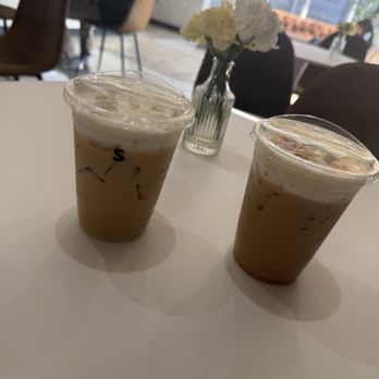 Fein Coffee - iced Foster Banana with banana oat milk and an iced Spanish Latte with almond milk - Coffee & Tea Near Me - Houston, Texas Fein Coffee - iced Foster Banana with banana oat milk and an iced Spanish Latte with almond milk - Coffee & Tea Near Me - Houston, Texas