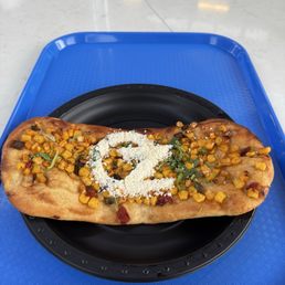 Roasted corn flatbread; cute presentation with cheese in the shape of Oz but disappointing flavor. Would not get this again.