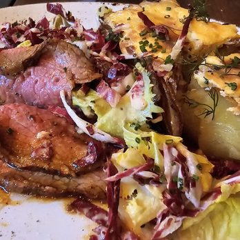 Mountain Standard - Tri-tip & scalloped potato. Thank God the tri tip is cooked well because tri-tip is not a  high-end kind of meat. - New American Near Me - Vail, Colorado