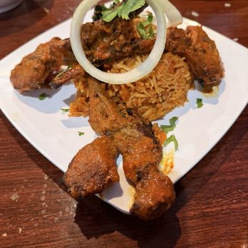 Aroma Grill & Bar - Lamb Lollipops served atop Biryani rice with a Coconut Curry Sauce. - Indian Near Me - Keller, Texas Aroma Grill & Bar - Lamb Lollipops served atop Biryani rice with a Coconut Curry Sauce. - Indian Near Me - Keller, Texas
