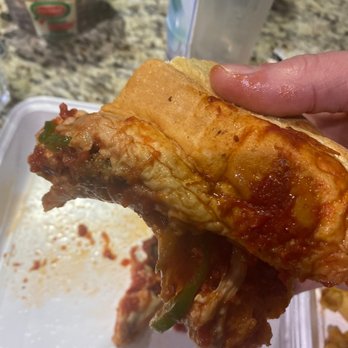 I Love NY Pizza - a hand holding a chicken sandwich - Italian Near Me - Alpharetta, Georgia I Love NY Pizza - a hand holding a chicken sandwich - Italian Near Me - Alpharetta, Georgia