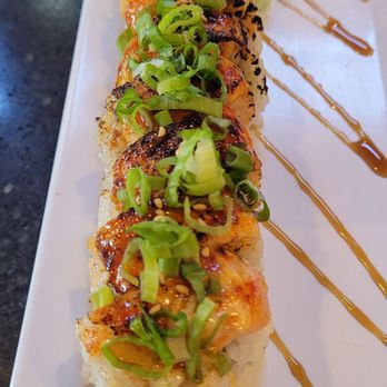Trapper's Sushi - Ceo Roll- seared salmon, cream cheese inside shrimp, avocado,topped with Covington sauce and green onion, puts Trump roll to shame! - Sushi Bars Near Me - Enumclaw, Washington