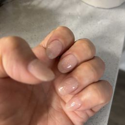 Dip powder with neutral color and some glitter finish