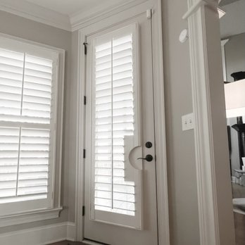 Carolina Blind Crafters - Wood plantation shutters with 3 1/2" louvers and a custom door handle cutout - Shades & Blinds Near Me - Raleigh, North Carolina Carolina Blind Crafters - Wood plantation shutters with 3 1/2" louvers and a custom door handle cutout - Shades & Blinds Near Me - Raleigh, North Carolina