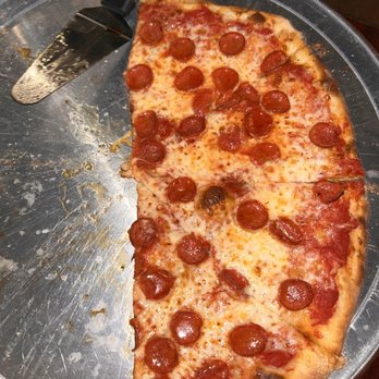 Curro’s - Half eaten pepperoni pizza - Pizza Near Me - Eagle Pass, Texas