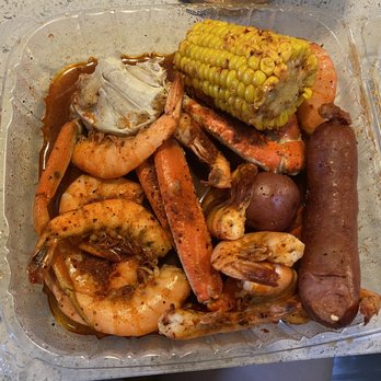 Lotus Seafood - Hot Box with a dozen of shrimps, 1lb of snow crab, and corn, potato, and sausage. - Cajun/Creole Near Me - Houston, Texas Lotus Seafood - Hot Box with a dozen of shrimps, 1lb of snow crab, and corn, potato, and sausage. - Cajun/Creole Near Me - Houston, Texas
