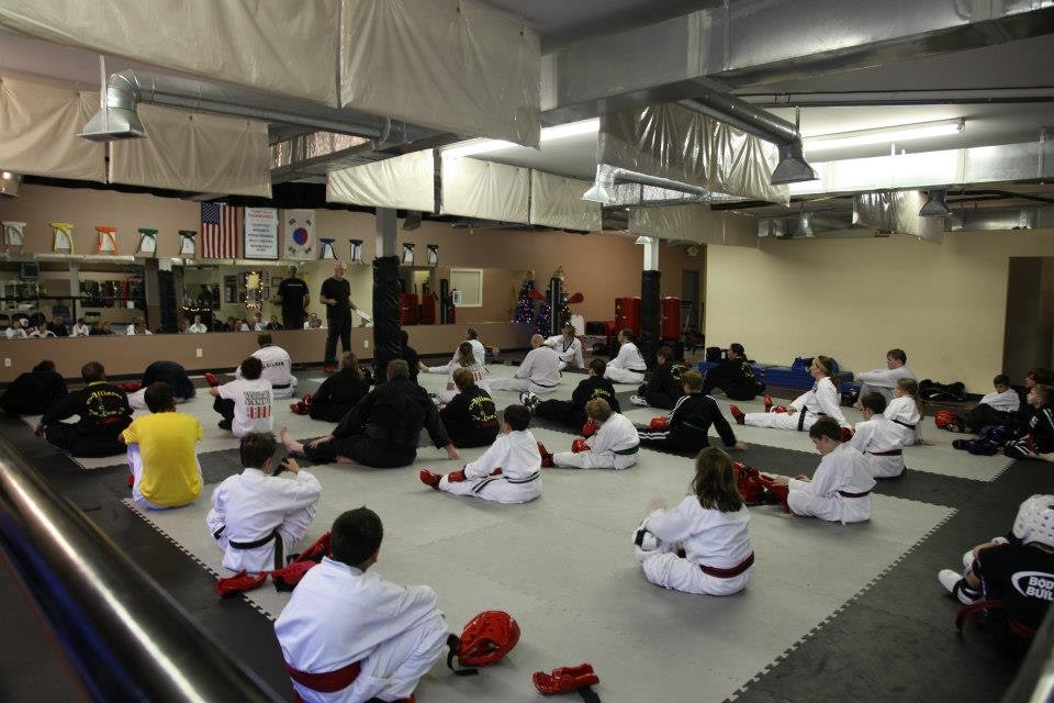 Karen Mitchell's Impact Martial Arts Logo