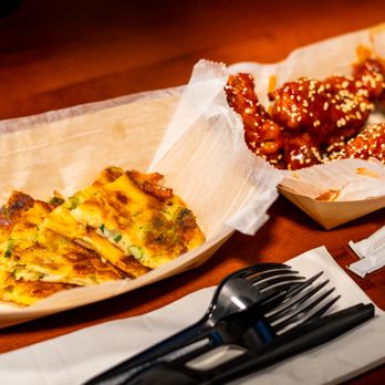 Miki's Karaoke Bar - two pieces of pizza and a fork - Korean Near Me - Louisville, Kentucky Miki's Karaoke Bar - two pieces of pizza and a fork - Korean Near Me - Louisville, Kentucky