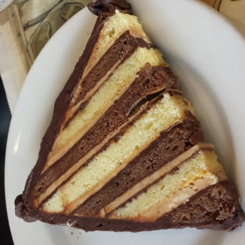 Mirabelles Bakery - The pyramid cake. Like one giant petit four. They should call it a petit fourteen :-D - Bakeries Near Me - South Burlington, Vermont Mirabelles Bakery - The pyramid cake. Like one giant petit four. They should call it a petit fourteen :-D - Bakeries Near Me - South Burlington, Vermont