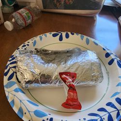 My "giant" Macho Combo Burrito compared to the tiny hot sauce pack its pathetic!