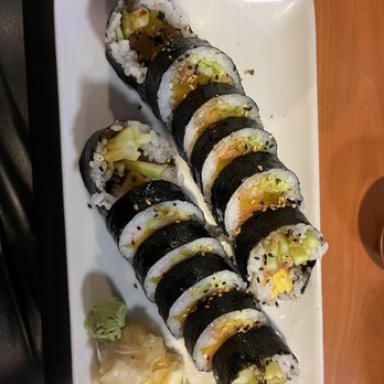 Sushibucks - Kimbap - A rectangular white plate holds ten sushi rolls with seaweed wrapping, filled with rice, cucumber, and other ingredients, garnished with sesame seeds. - Japanese Near Me - Albuquerque, New Mexico