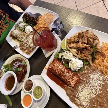 Dos Amigos Restaurant and Bar - Shredded beef with red enchilada sauce. Bomb chicken fried taco companied with onions and peppers. Along with those three salsas. - Mexican Near Me - Stanton, California Dos Amigos Restaurant and Bar - Shredded beef with red enchilada sauce. Bomb chicken fried taco companied with onions and peppers. Along with those three salsas. - Mexican Near Me - Stanton, California