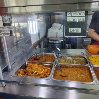 Curry Time - Check the signs atop the glass for the name of food. - Indian Near Me - El Monte, California