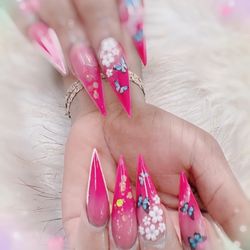 TD Nail Salon - Empower Your Style: Stiletto Nails in Pink with Floral Elegance and Butterfly Grace.