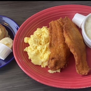 The Clique Restaurant - Catfish and grits with scrambled eggs and pancakes - New American Near Me - Detroit, Michigan The Clique Restaurant - Catfish and grits with scrambled eggs and pancakes - New American Near Me - Detroit, Michigan