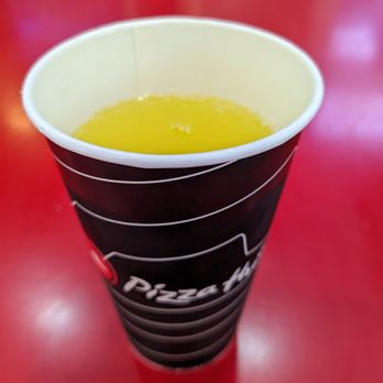 Pizza Hut - a red table with a cup of pizza hut - Pizza Near Me - Valparaiso, Indiana