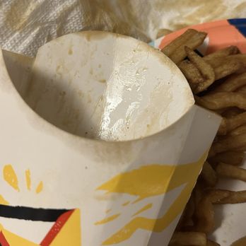 Hardee's - Watery brown stuff on fry box. - Fast Food Near Me - Box Elder, South Dakota