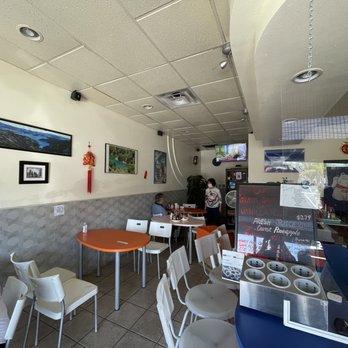 Quickly - a woman sitting at a table in a restaurant - Juice Bars & Smoothies Near Me - Artesia, California Quickly - a woman sitting at a table in a restaurant - Juice Bars & Smoothies Near Me - Artesia, California
