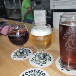 two glasses of beer on a bar two glasses of beer on a bar