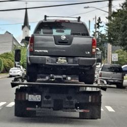 Hudson Auto Center - Still has the fake plates on lol....good advertising for Hudson, on the back of a flatbed