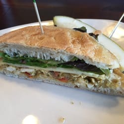 The red chicken sandwich is a spicy treat for lunch. The bread is soft and the chicken is delicious.