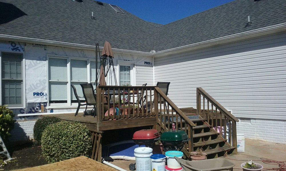 Slide of Tim's Roofing