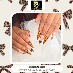 SNS Exclusive Salon - Cheetah nails with fall tones for a fierce, festive touch. Wild elegance that fits every Thanksgiving mood. Book your bold look today!