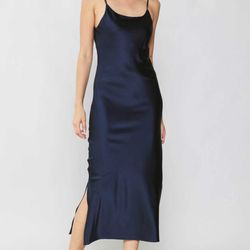jaunts - This luxe, mid-length slip dress has that alluring '90s minimalist look down pat. featured sexy little slit