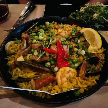Olé Tapas Bar & Kitchen - TRADITIONAL PAELLA VALENCIANA Mussels, clams, calamari, shrimp, chicken & grilled sausages - Spanish Near Me - Long Beach, California