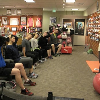 Balance Chiropractic - Dr. Yang teaches a post-workout stretch to the running academy members at A Snail's Pace Running Store in Monrovia - Chiropractors Near Me - Monrovia, California