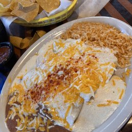 Chicken enchiladas with rice and beans. Chicken enchiladas with rice and beans.