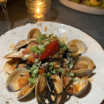 The Ice Plant - FRESH BUCATINI AL NERO & CEDAR KEY CLAMS PANCETTA, TOMATOES, CALABRIAN CHILI, PECORINO, BASIL - Cocktail Bars Near Me - St. Augustine, Florida