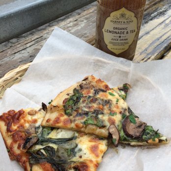 Cheese Board Pizza - A slice of pizza with a lemonade and tea drink - Pizza Near Me - Berkeley, California