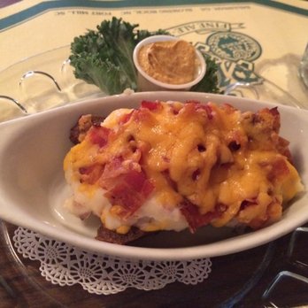 Six Pence Pub - The loaded banger - an English sausage sliced down the middle and filled with mashed potatoes, cheddar cheese, and bacon. - Pubs Near Me - Savannah, Georgia Six Pence Pub - The loaded banger - an English sausage sliced down the middle and filled with mashed potatoes, cheddar cheese, and bacon. - Pubs Near Me - Savannah, Georgia