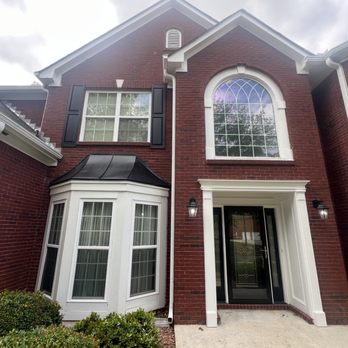 Solid Coat Painting - Red brick house with freshly painted trim, shutters and doors. - Painters Near Me Solid Coat Painting - Red brick house with freshly painted trim, shutters and doors. - Painters Near Me