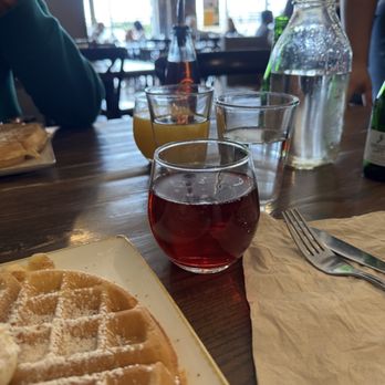 First Watch - Mimosa (with Cranberry) Mimosa (with orange juice in the back) - Breakfast & Brunch Near Me - Columbus, Ohio
