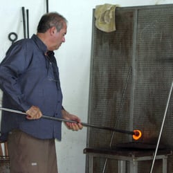 Murano Venetian Glass Center - He re-warms and works it some more....
