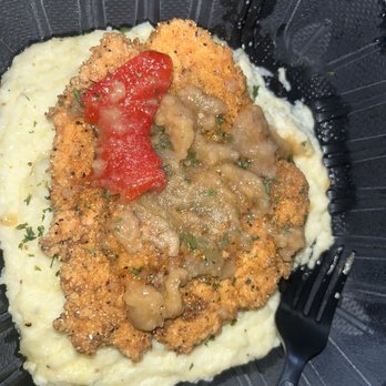 The District By GS - Fried salmon and grits with gravy. Ordered through DoorDash. Where is the gravy! - Bars Near Me - Los Angeles, California