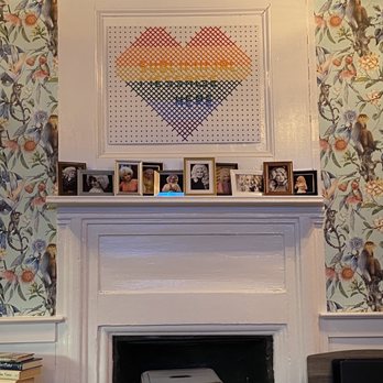 Pimiento Tea Room - The fireplace with an homage to the Queen Dolly Parton and some LGBTQ+ love. - Tea Rooms Near Me - Holly Springs, North Carolina Pimiento Tea Room - The fireplace with an homage to the Queen Dolly Parton and some LGBTQ+ love. - Tea Rooms Near Me - Holly Springs, North Carolina