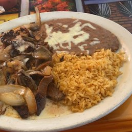 Steak Fundido. More than just Steak with onions and mushrooms smothered in cheese sauce. The flavor is so good.
