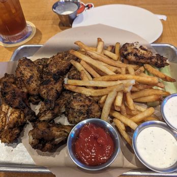 Twin Peaks - 12 Smoked wings with the Cajun Rub with Fries and celery sticks and Ranch Dipping sauce - Sports Bars Near Me - Webster, Texas Twin Peaks - 12 Smoked wings with the Cajun Rub with Fries and celery sticks and Ranch Dipping sauce - Sports Bars Near Me - Webster, Texas