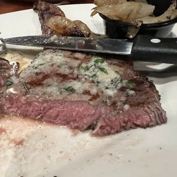 Black Angus Steakhouse - Ribeye with roasted garlic and herb butter - Steakhouses Near Me - Santa Ana, California