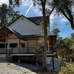 Two stories of gutters - 7" black with square downspouts
