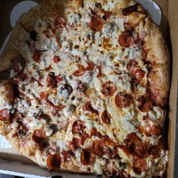 Three Brothers Pizza & Grill - Cheese in the corner of the box from being not completely done throughout.