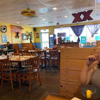 El Ranchito Mexican Grill - a woman sitting at a table - Mexican Near Me - Crystal River, Florida El Ranchito Mexican Grill - a woman sitting at a table - Mexican Near Me - Crystal River, Florida