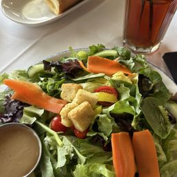 Salad, french bread and ice tea Salad, french bread and ice tea