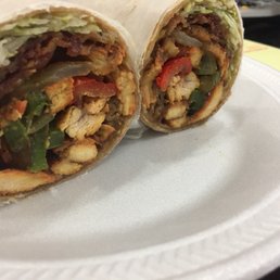 Grilled chicken with peppers and onions on a whole wheat wrap Grilled chicken with peppers and onions on a whole wheat wrap