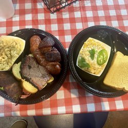 Brisket, sausage, pork belly burnt ends, bacon wrapped stuffed jalapeño, mac & cheese, street corn, and bread.