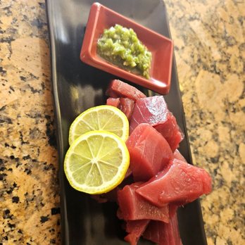 Sushi Plus - a plate of raw tuna and a slice of lemon - Japanese Near Me - Fountain Valley, California Sushi Plus - a plate of raw tuna and a slice of lemon - Japanese Near Me - Fountain Valley, California